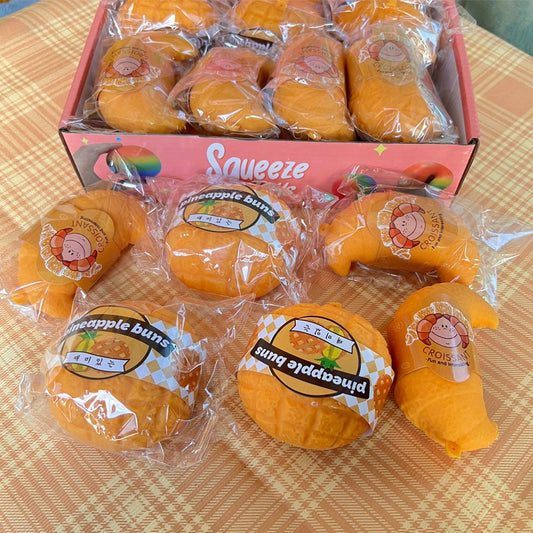 "Realistic bread squishy toy croissant pineapple bun soft silicone stress relief food-themed fidget toy"