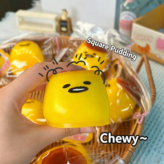 "Hand squeezing soft pudding squishy toy showing slow rebound effect"
