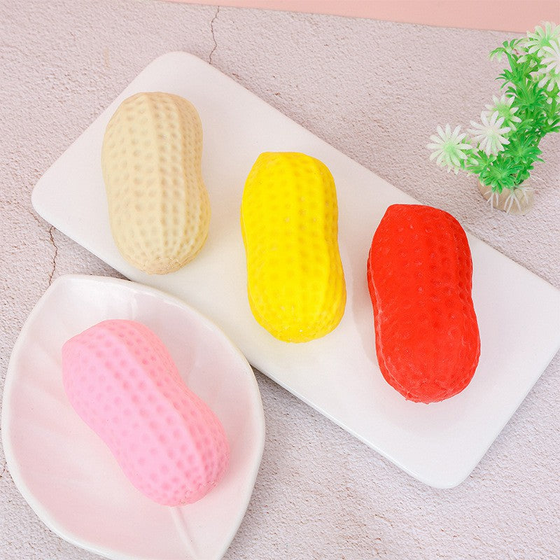 "Hand squeezing soft peanut-shaped squishy toy showing slow rebound effect"