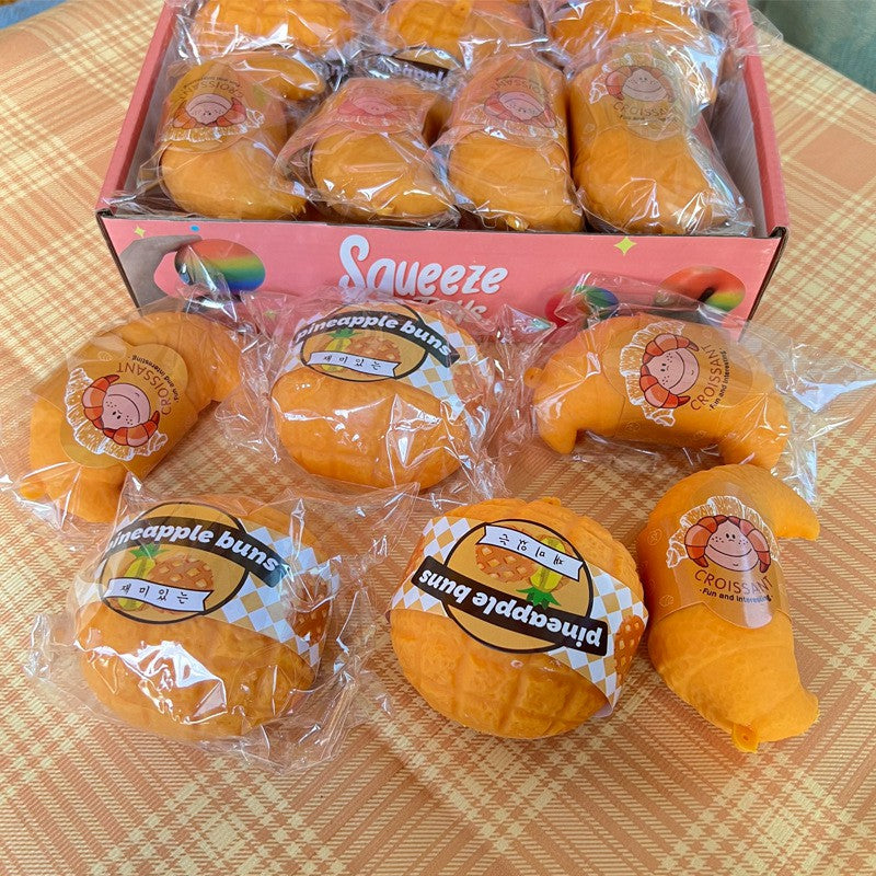 "Realistic bread squishy toy croissant pineapple bun soft silicone stress relief food-themed fidget toy"