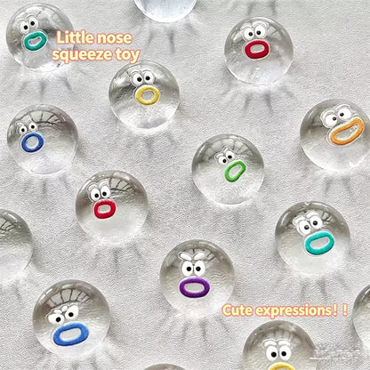 "Bulk assorted colorful little nose squeeze toys with different fuzzy mouth expressions"