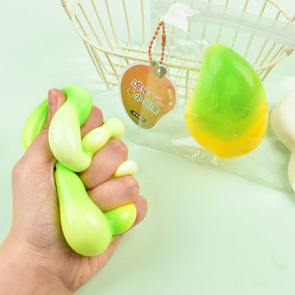"Multiple fluid mango squishy toys displayed on a light green background"