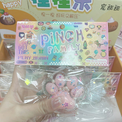 "Individually packaged hologram card cat paw squishy fidget toy multiple pastel colors"