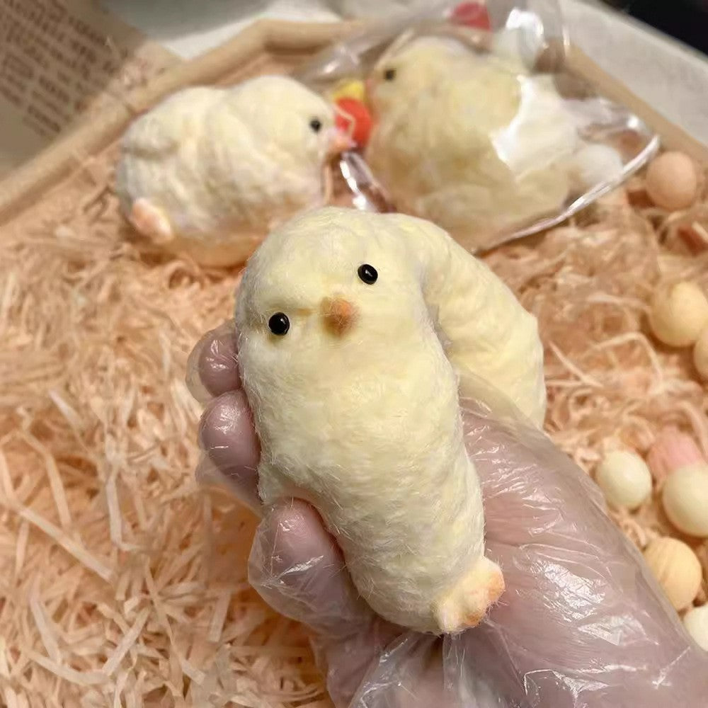 "Realistic fuzzy chick squeeze toy with soft texture for anxiety relief"