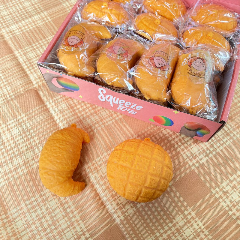 "Realistic bread squishy toy croissant pineapple bun soft silicone stress relief food-themed fidget toy"