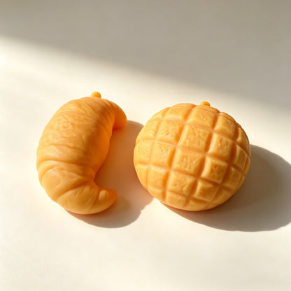 "Realistic bread squishy toy croissant pineapple bun soft silicone stress relief food-themed fidget toy"