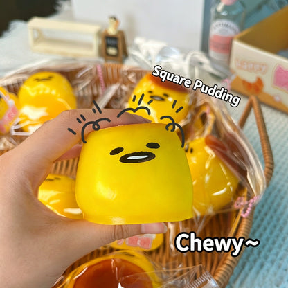 "Hand squeezing soft pudding squishy toy showing slow rebound effect"