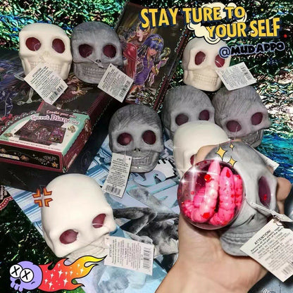 "White and gray skull squeeze toys displayed in bulk packaging"