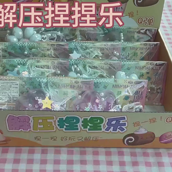 "Hand pinching glitter cat paw squeeze toy with floating star sequin and pearl inside"