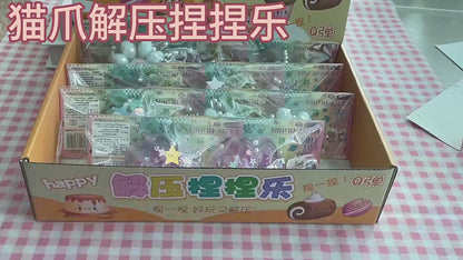 "Hand pinching glitter cat paw squeeze toy with floating star sequin and pearl inside"