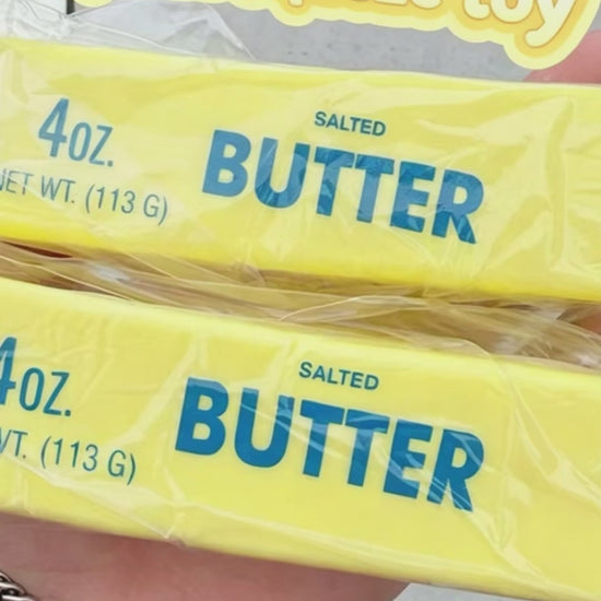 "Lifelike butter bar squeeze toy with unique sticky-to-touch sensory effect"