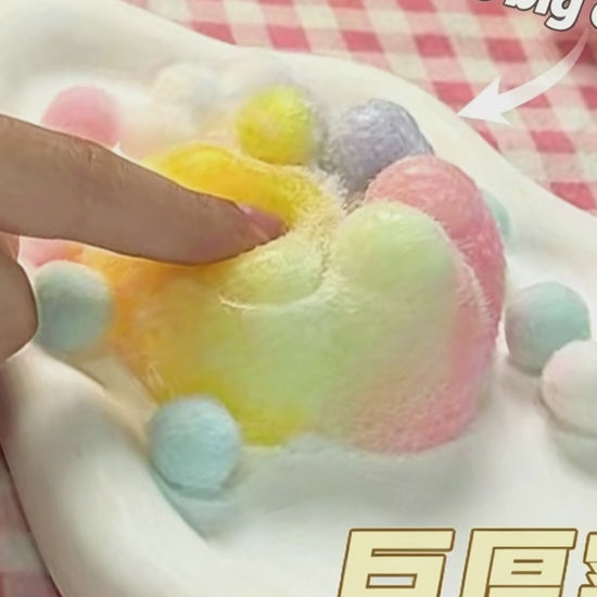 "Hand squeezing plush cat paw squeeze toy showing soft and flowing texture"