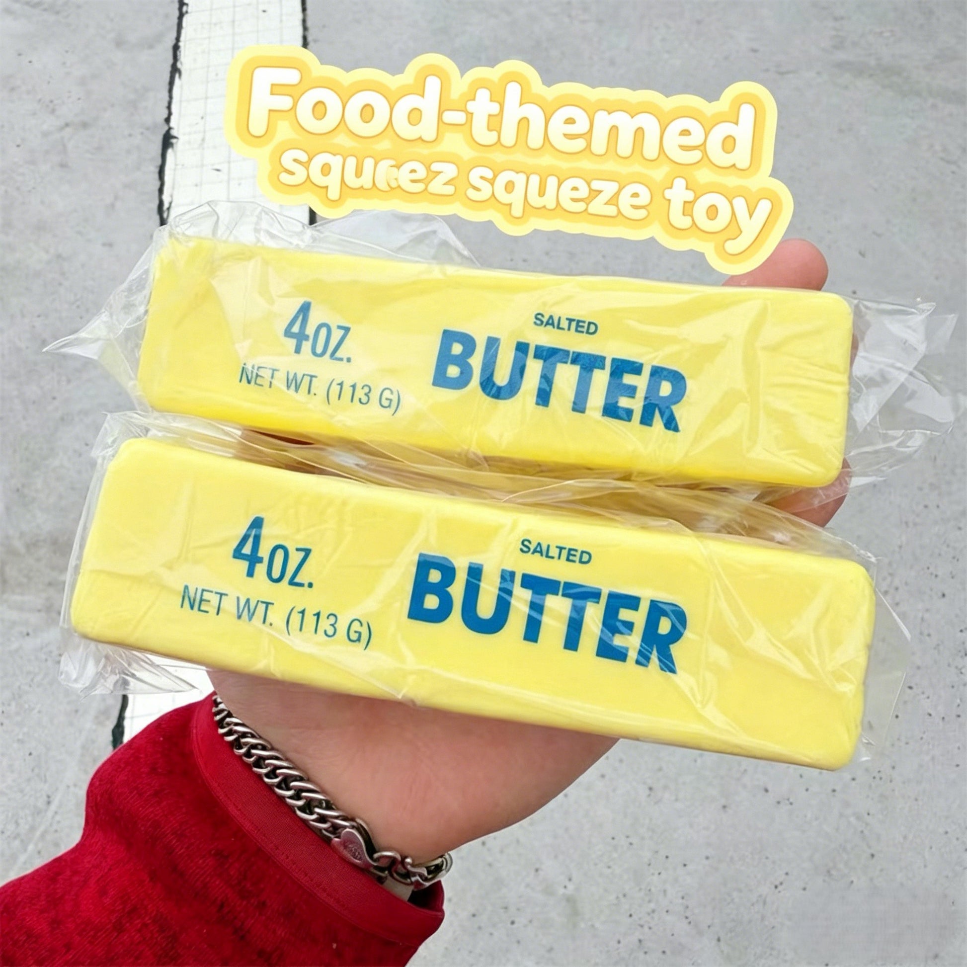 "Hand squeezing soft butter-shaped squishy toy showing slow rebound and sticky feel"